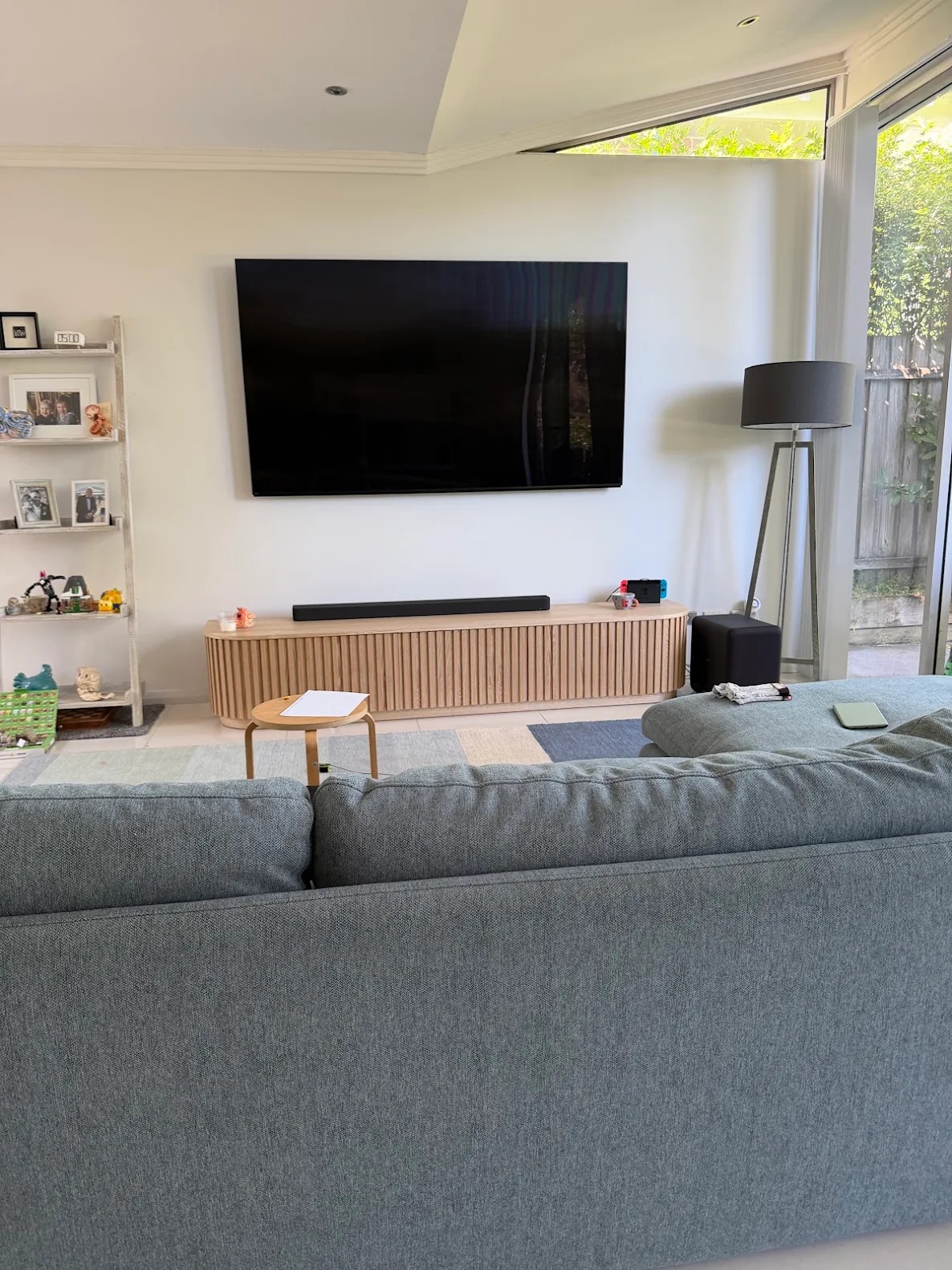 Lounge room TV mount with soundbar installed underneath
